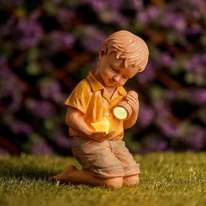 Solar Boy Garden Ornament LED Light Up Flashlight Duck Outdoor Stone Effect