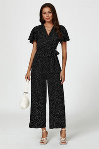 Dot Print Wrap Top Jumpsuit In Black