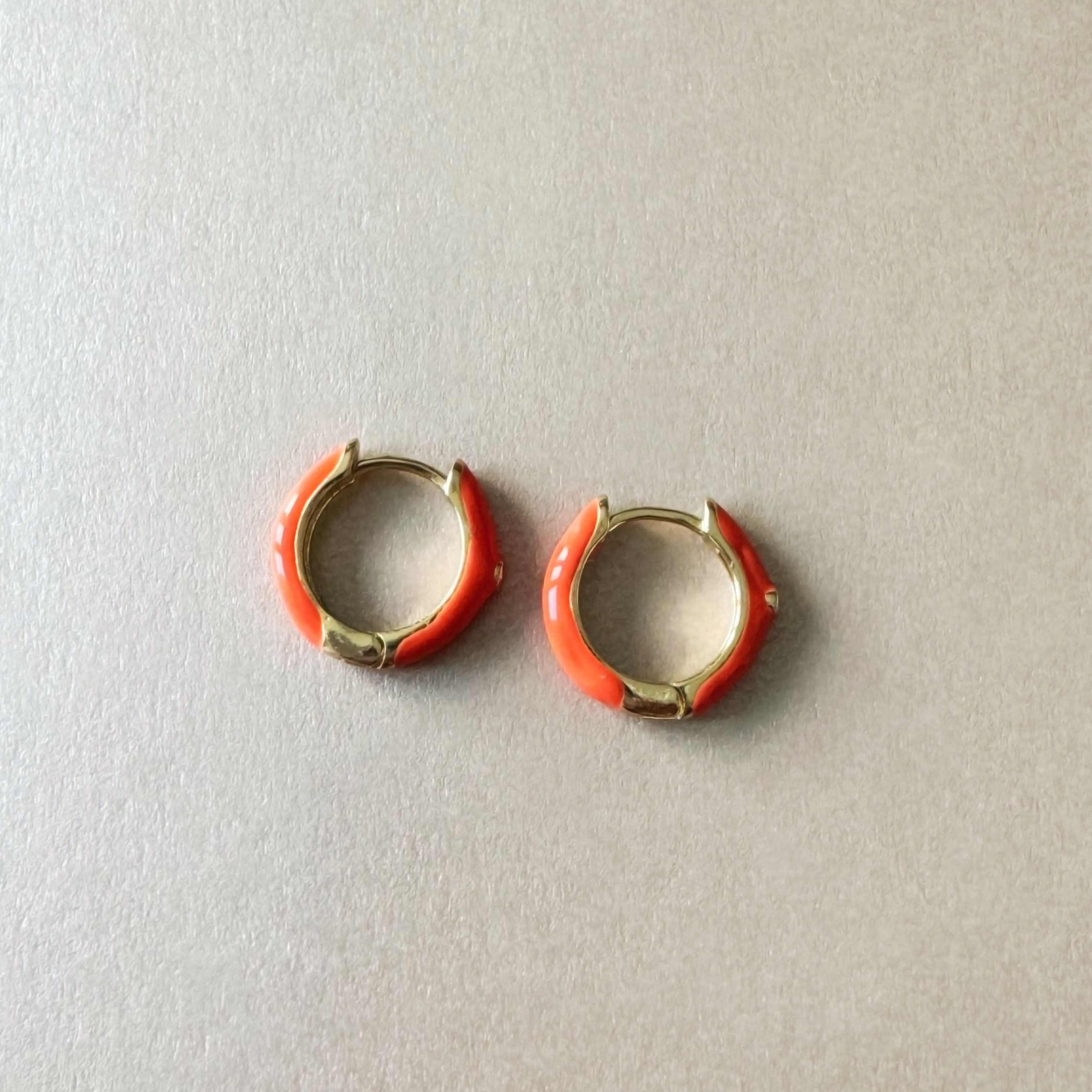 Clemmie Orange Mini Huggie Hoop Earrings
