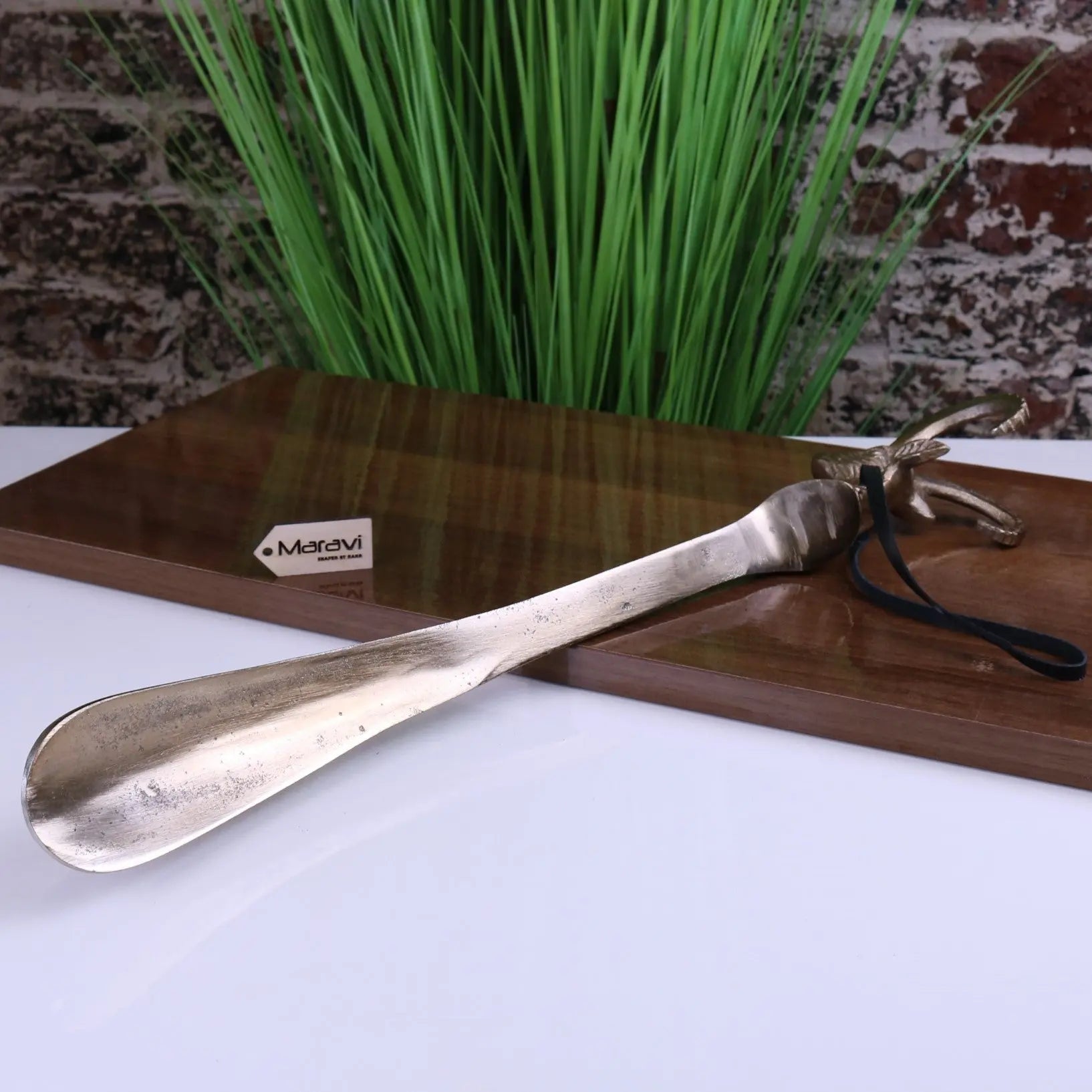 Kaisa Ram's Head Antique Gold Shoe Horn for Stylish and Effortless Wear