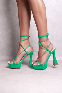 ADLEY FLARED BLOCK HIGH HEELS WITH STRAPPY FRONT KNOT AND LACE UP DETAIL IN JADE GREEN