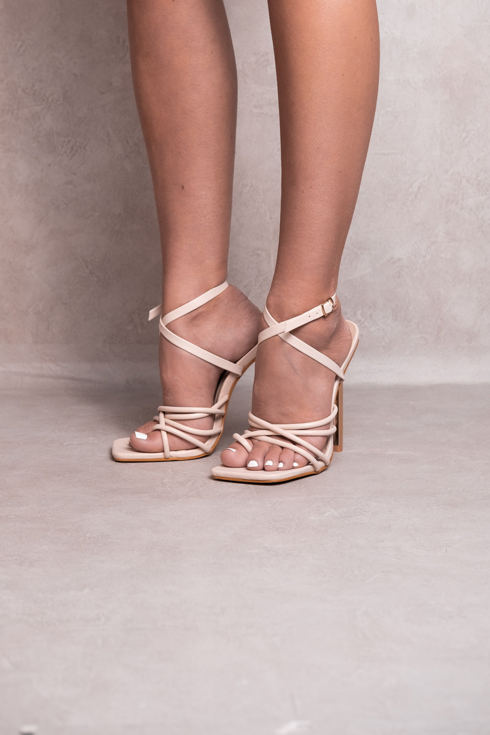 ANNABELLA HIGH HEELS WITH CROSSOVER STRAPS AND ANKLE STRAP DETAIL IN IVORY CREAM FAUX LEATHER