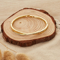 Gold Plated Arc Bangle Created with Zircondia® Crystals (7 Inch)