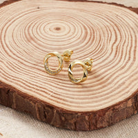 Gold Plated Circle Twist Earrings Created with Zircondia® Crystals
