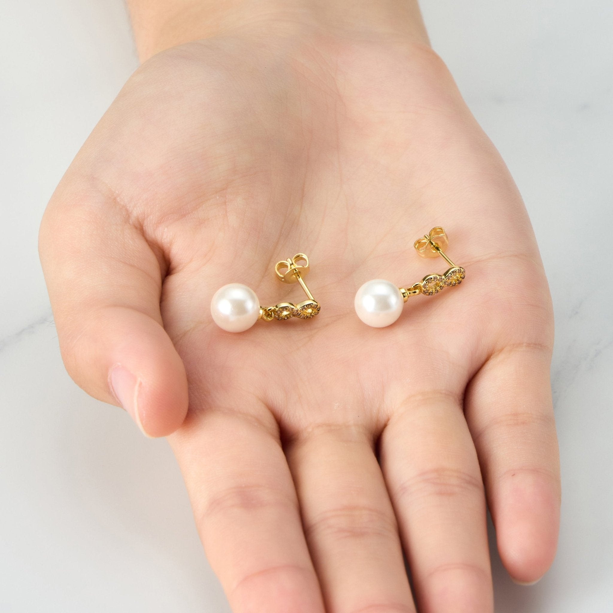 Gold Plated Infinity Pearl Drop Earrings Created with Zircondia® Crystals