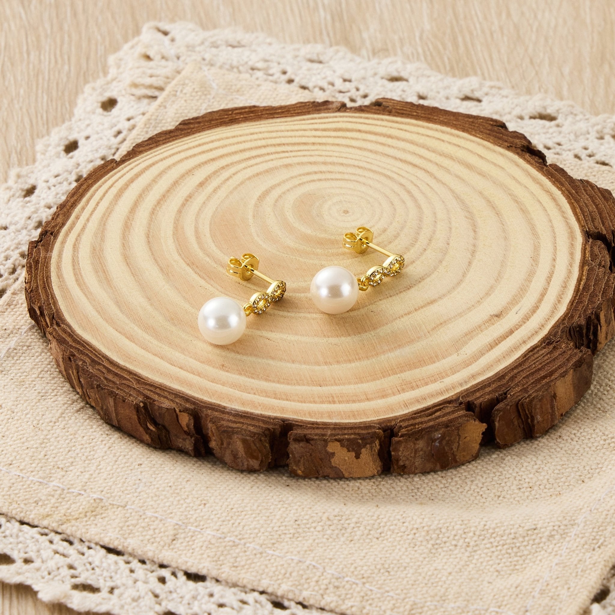 Gold Plated Infinity Pearl Drop Earrings Created with Zircondia® Crystals