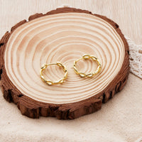 Gold Plated Infinity Hoop Earrings Created with Zircondia® Crystals