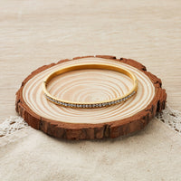 Gold Plated Stainless Steel Channel Set Bangle Created with Zircondia® Crystals (7 Inch)