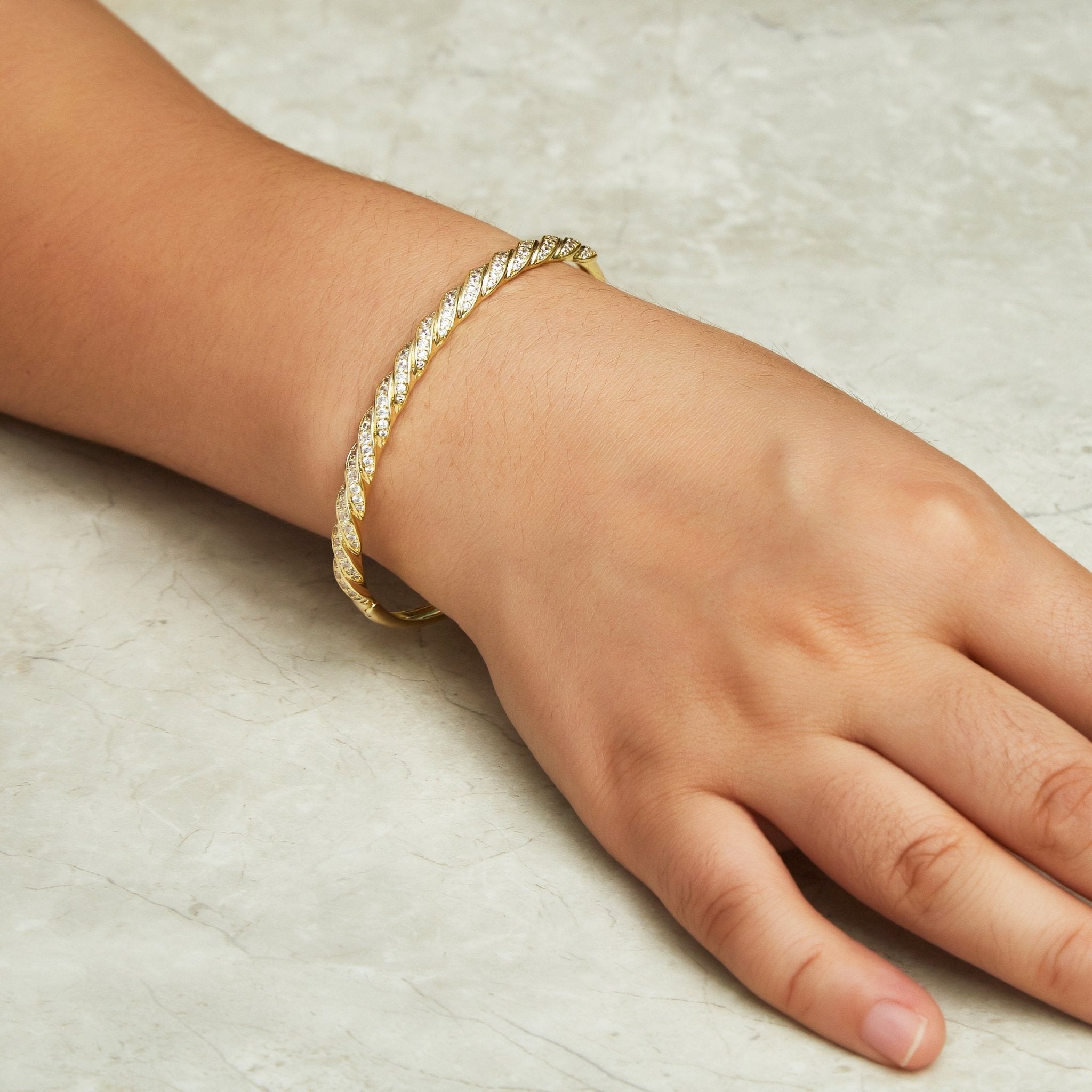 Gold Plated Twist Bangle Created with Zircondia® Crystals (7 Inch)