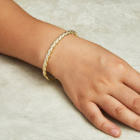 Gold Plated Twist Bangle Created with Zircondia® Crystals (7 Inch)