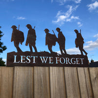 A Rusty Metal Lest We Forget Soldier Scene Garden Decoration