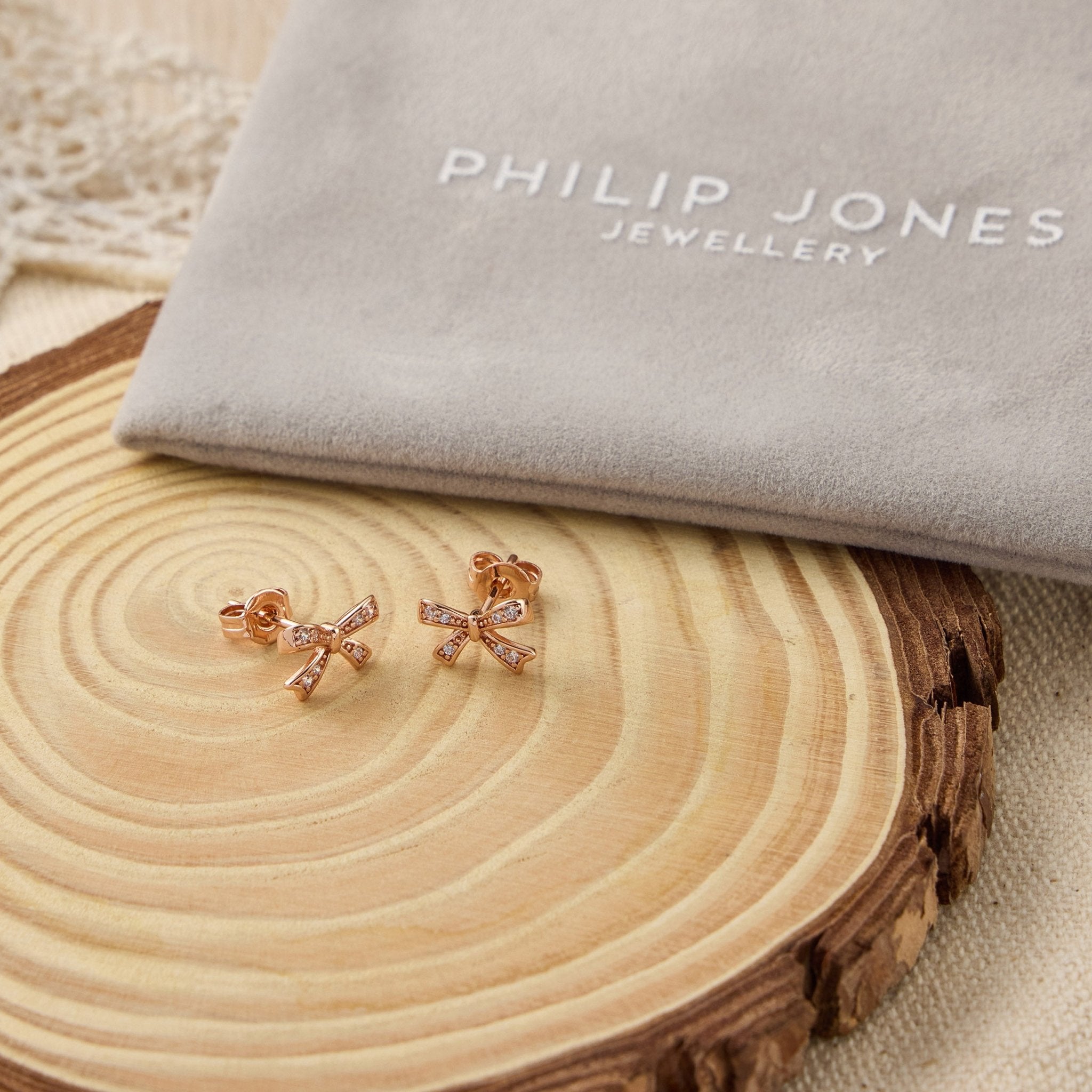 Rose Gold Plated Bow Earrings Created with Zircondia® Crystals