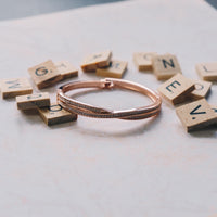 Rose Gold Plated Crossover Bangle Created with Zircondia® Crystals (7 Inch)