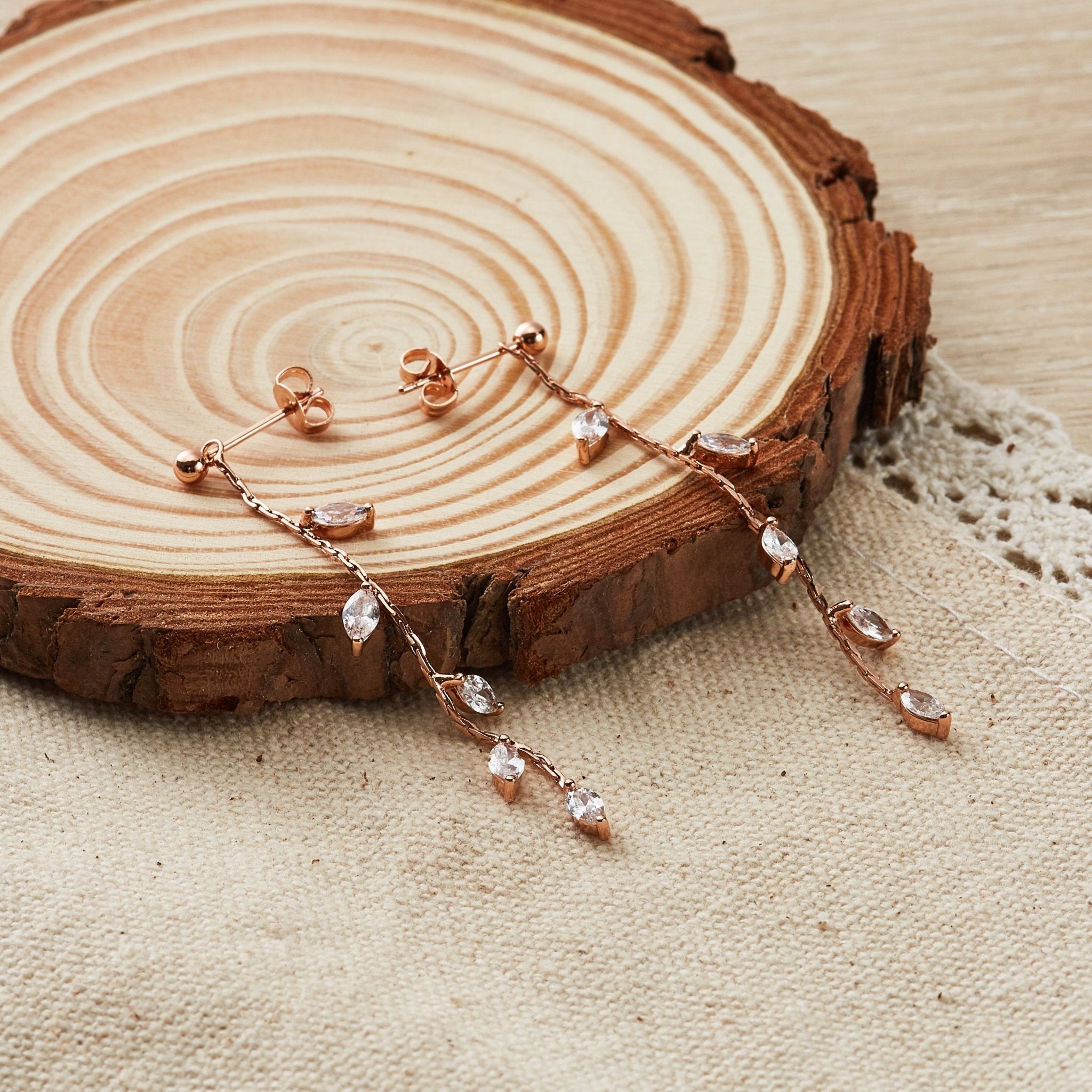 Rose Gold Plated Leaf Dangle Earrings Created with Zircondia® Crystals