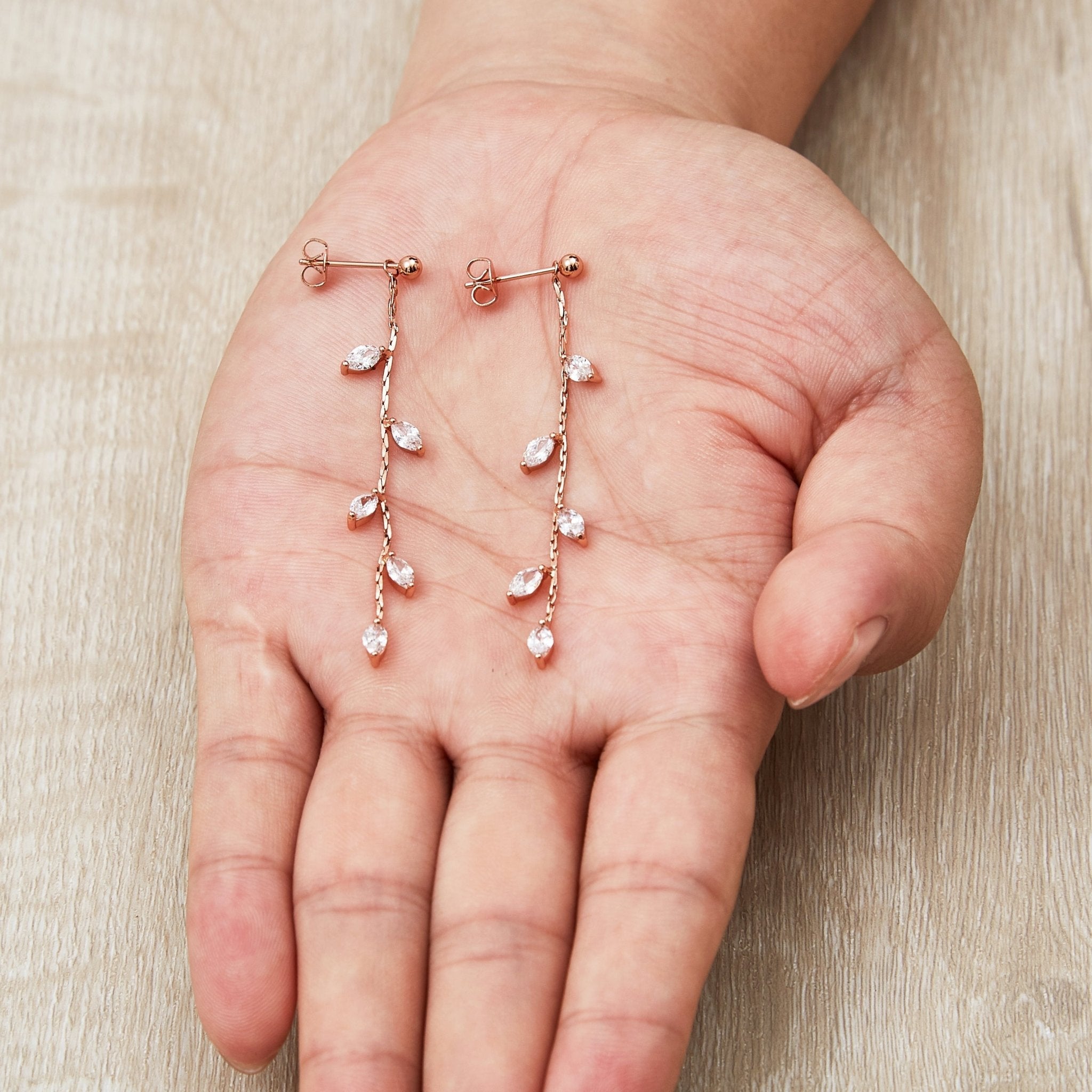 Rose Gold Plated Leaf Dangle Earrings Created with Zircondia® Crystals