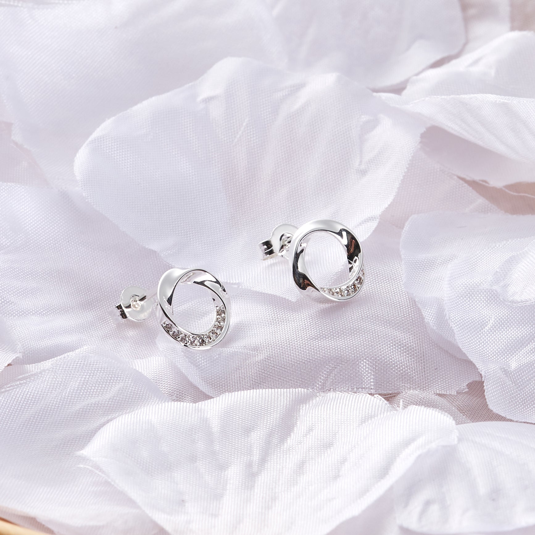 Silver Plated Circle Twist Earrings Created with Zircondia® Crystals