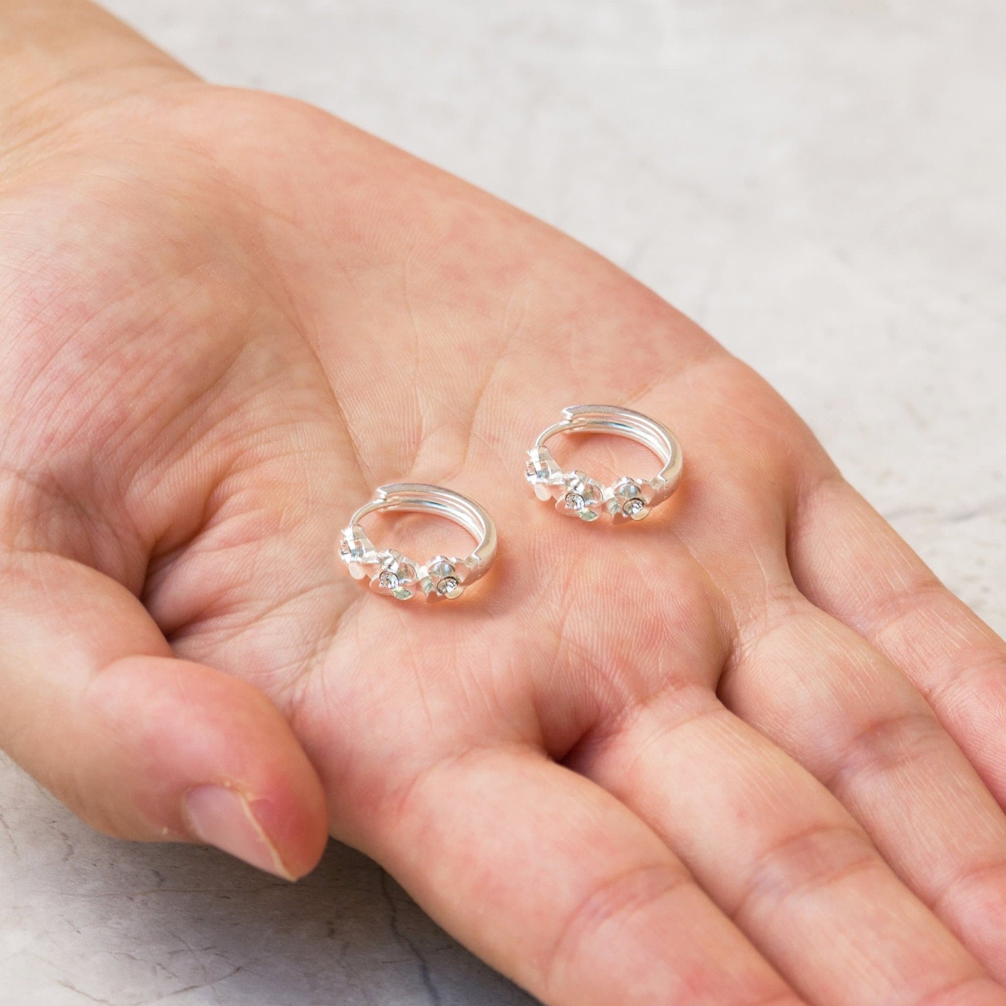 Silver Plated Flower Hoop Earrings Created with Zircondia® Crystals