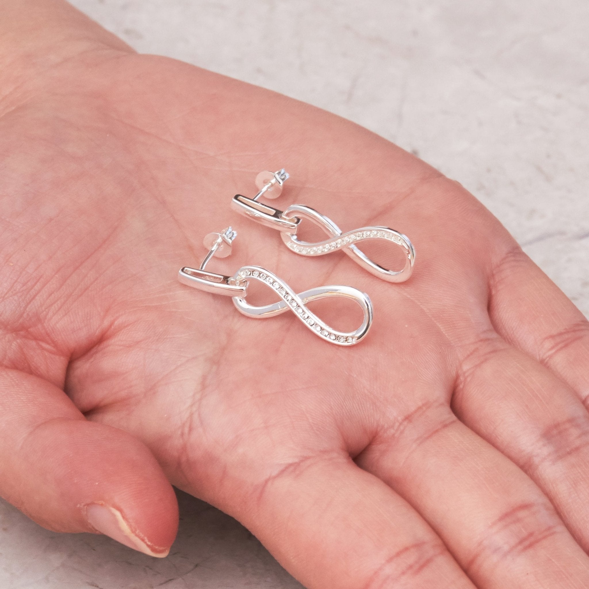 Silver Plated Infinity Drop Earrings Created with Zircondia® Crystals