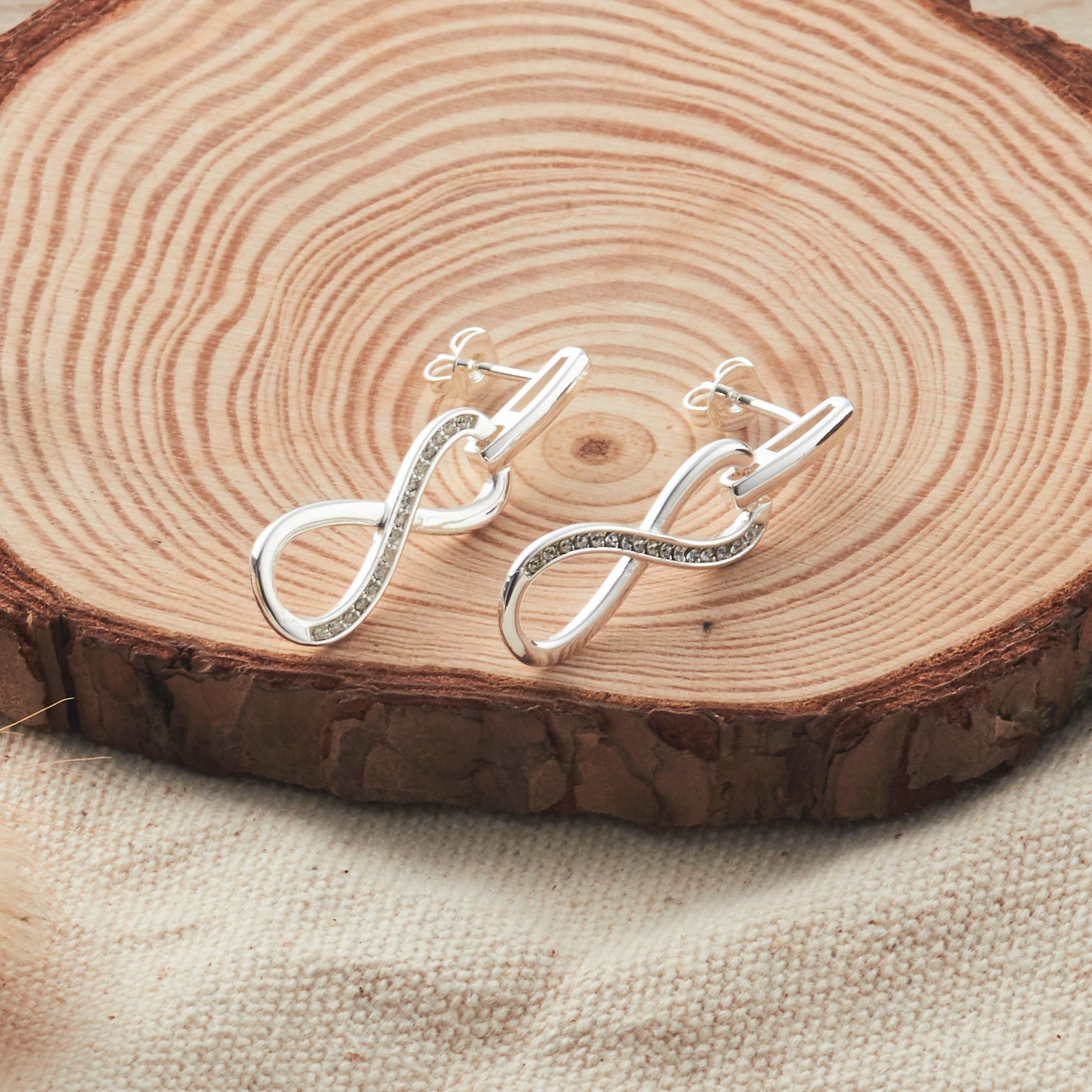 Silver Plated Infinity Drop Earrings Created with Zircondia® Crystals