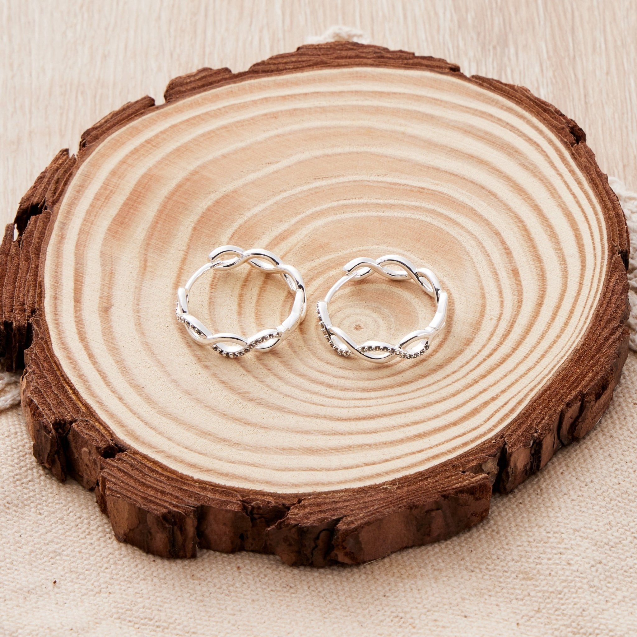 Silver Plated Infinity Hoop Earrings Created with Zircondia® Crystals