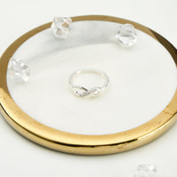 Silver Plated Infinity Ring Created with Zircondia® Crystals