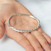 Silver Plated Twist Bangle Created with Zircondia® Crystals (7 Inch)