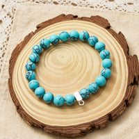 Synthetic Turquoise Gemstone Stretch Bracelet with Charm Created with Zircondia® Crystals